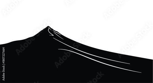 Dramatic black silhouette of a majestic mountain peak against a stark white sky.