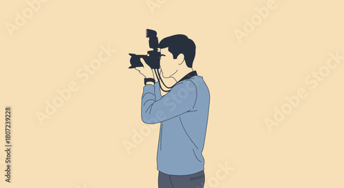 A person, side view, holding up a camera with flash attachment, eye to the viewfinder, against a neutral background