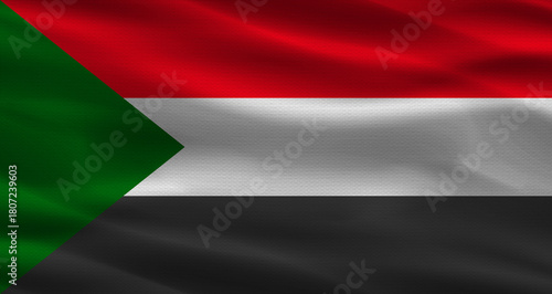 Sudan flag with fabric texture. Realistic flag of Sudan waving