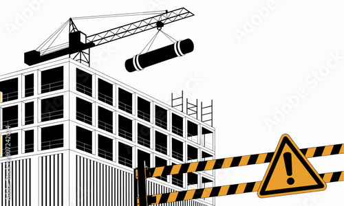 Construction site with crane lifting cylindrical object and warning sign for safety awareness projects