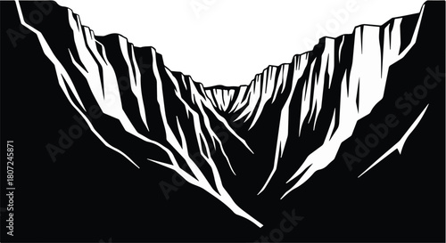 Dramatic deep canyon with stark shadows and sheer rock faces