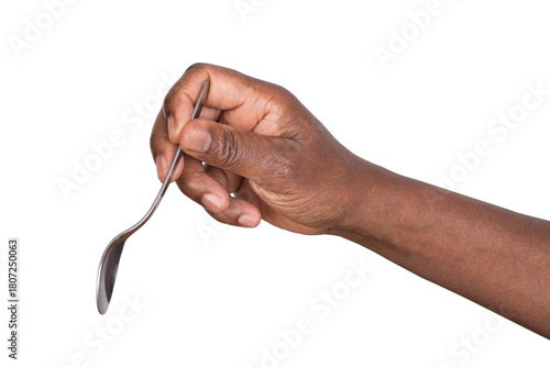 Hand holding a steel teaspoon isolated on white or transparent background 