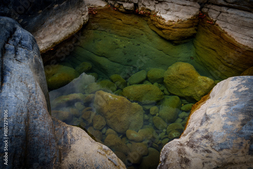 Emerald rock pool in sculpted limestone