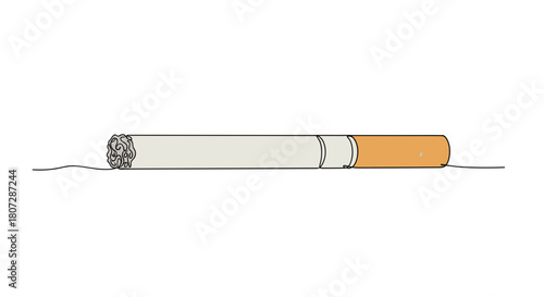 Cigarette lying on a flat surface with a neutral background  