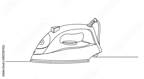 Iron appliance for home use with cord on a flat surface  