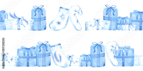 Hand drawn watercolor blue presents stockings and candy canes seamless frame border. Illustration isolated on white background. Can be used for postcard label textile and other printed products.