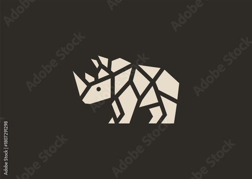 A strong geometric rhinoceros logo formed with sharp polygonal contours and structured line blocks, symbolizing power, protection, and resilience in a clean minimalist vector style