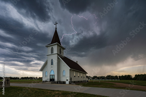 Lightning Strike near the Berea Evangelical Lutheran Church, a small church under a dark threatening sky. 