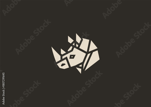 A strong geometric rhinoceros logo formed with sharp polygonal contours and structured line blocks, symbolizing power, protection, and resilience in a clean minimalist vector style