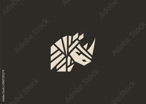 A strong geometric rhinoceros logo formed with sharp polygonal contours and structured line blocks, symbolizing power, protection, and resilience in a clean minimalist vector style