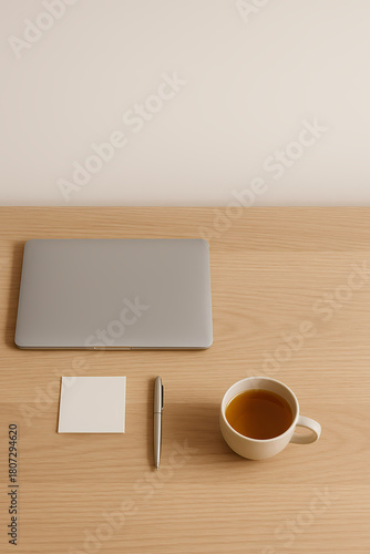 Minimal home office desk with closed laptop and no phone for focused digital detox work
