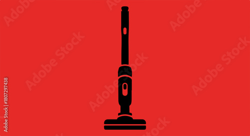 Black silhouette of a cordless upright vacuum cleaner on a bright red background