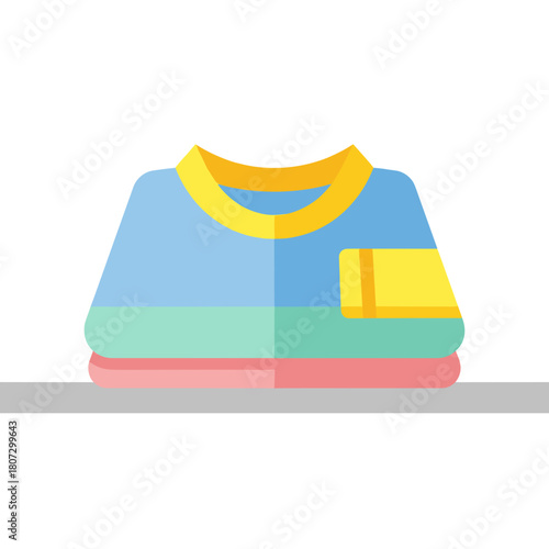 Folded medical gown on table in vibrant colors  