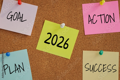 5 post-it paper pin on board with number 2026 in the middle and word goal, plan, action, success around. new year goal target concept