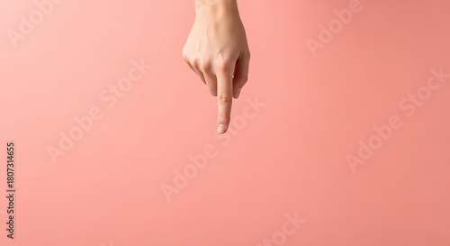 Hand, Womans hand pointing down on a pink background for product place