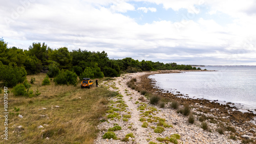 Fototapeta Naklejka Na Ścianę i Meble -  Remote Croatian Beaches Accessible Only by Off-Road Vehicles. Rugged coastline, untouched nature, wild Mediterranean landscapes and secluded turquoise shores captured from above