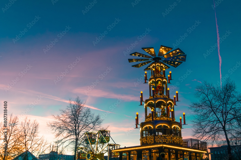 Fototapeta premium Colorful Christmas Festival Float With Illuminated Decorations, Stars, And Windmill Top