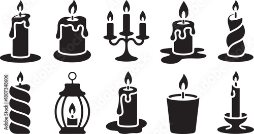 Assortment of ten black silhouette candles and a candelabra with lit flames Keywords: candle, candles, candelabra, flame, fire, light, burning, wax, dripping, twisted, spiral, lantern, holder