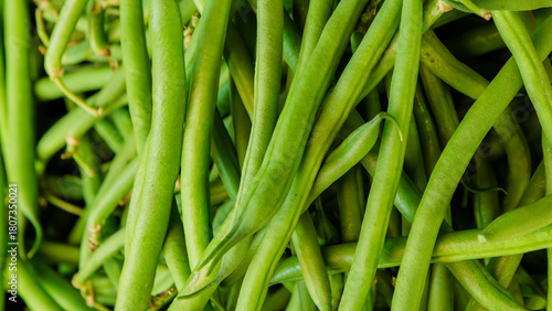 Fresh green French beans displayed at a vibrant market stall in Kenya, highlighting healthy tropical vegetables and local farm-to-market produce