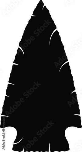 Black silhouette of arrowhead, ancient stone tool