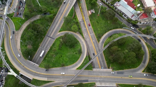 Overhead drone footage showing vehicles and road lanes at Los Cubos highway system in Guadalajara