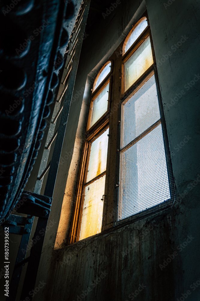 Fototapeta premium Inside the Historic Water Tower with Riveted Steel Tank, Spiral Staircase, Preserved Industrial Heritage in Komarno, Komarom, Slovakia