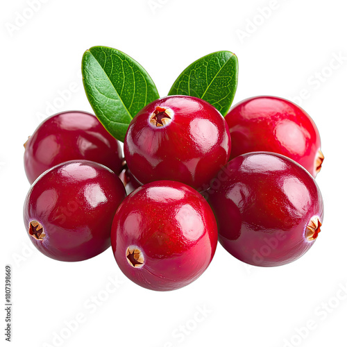 A cluster of vibrant red cranberries with bright green leaves isolated on a black background.