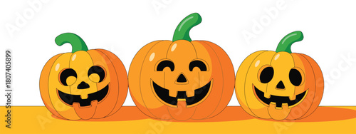 Three happy jack o lantern pumpkins with grinning faces on white background