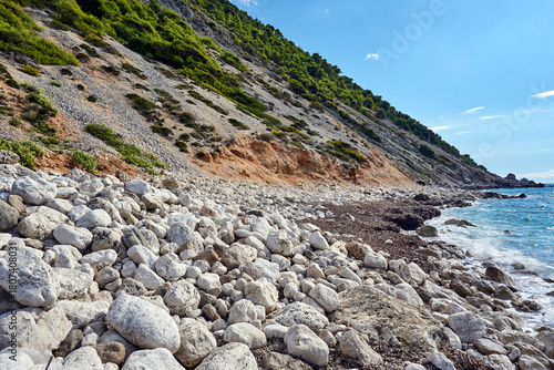 Fototapeta Naklejka Na Ścianę i Meble -  Cliff, stones, and boulders on a beach on Lefkada Island