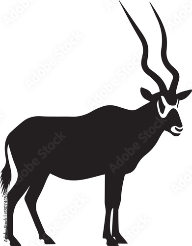 Striking silhouette of an addax antelope with majestic spiraling horns