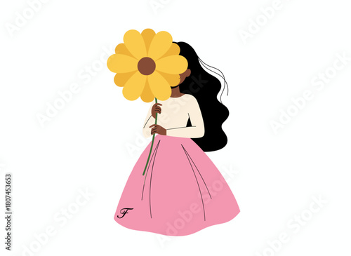 A beautiful woman holds a leaf, concealing her face with a floral plant in her hand