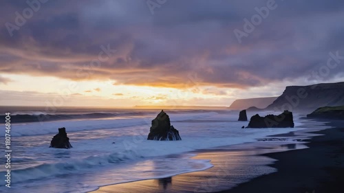 Dramatic sunset over a black sand beach with sea stacks and crashing waves Keywords: sunset, beach, black sand, sea stacks, rock