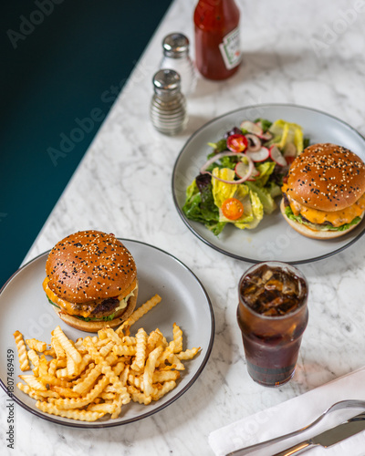 bacon cheeseburger on sesame seed bun in diner hard light