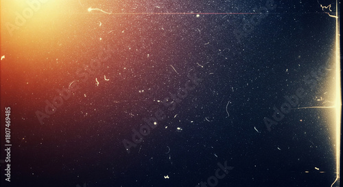 Vintage film grain texture with light leaks and dust for retro backgrounds. This textured background features a classic film grain effect, perfect for adding a nostalgic touch to your designs