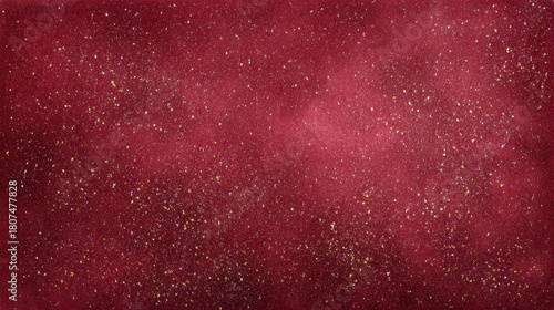 Red glitter background with gold fleck texture and soft bokeh lighting creating festive shimmer and warm holiday atmosphere