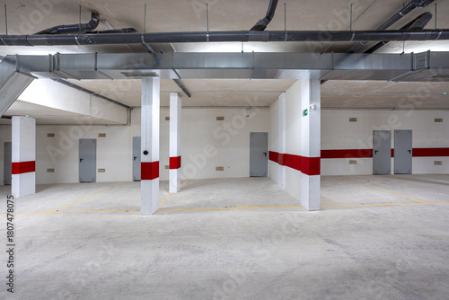 Underground parking garage with storage units and ventilation system