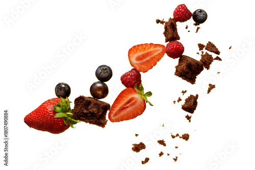 PNG image of  Fresh strawberries raspberries blueberries and brownie pieces are arranged in a visually appealing composition against a clean perfect for food blogs 