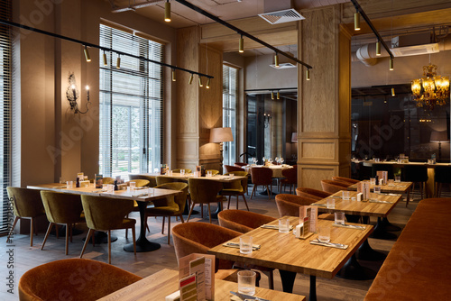 comfortable space with refined details, open restaurant space with ambient lighting and sophisticated decor