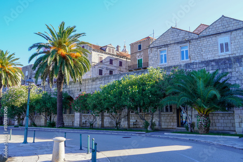Fototapeta Naklejka Na Ścianę i Meble -  Road around Korcula old town walls, Croatia. Korcula is a historic fortified town on the protected east coast of the island of Korcula.
