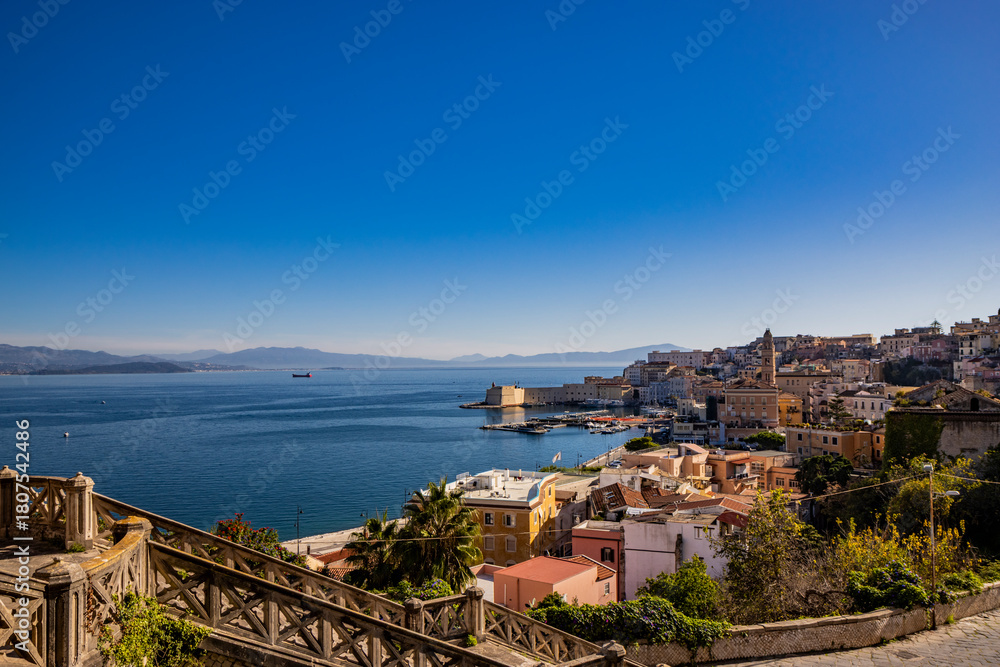 Obraz premium Gaeta, Latina, Lazio, Italy. A splendid view of the city. The ancient village with its houses overlooking the sea, seen from the top. The Angevin Castle at the top. The harbor with its moored boats.
