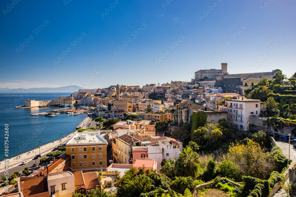 Obraz premium Gaeta, Latina, Lazio, Italy. A splendid view of the city. The ancient village with its houses overlooking the sea, seen from the top. The Angevin Castle at the top. The harbor with its moored boats.