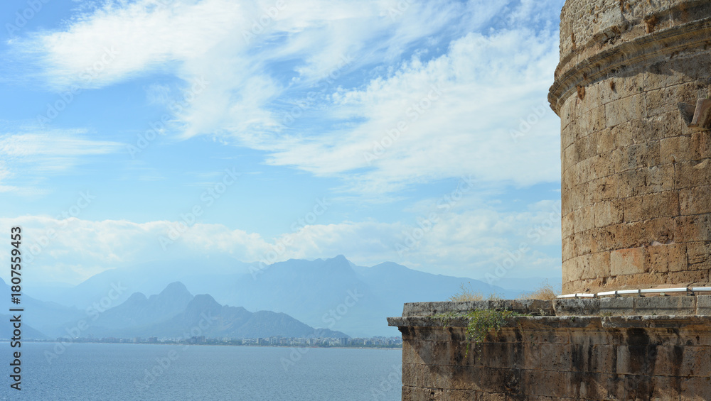 Fototapeta premium Beautiful mountain landscape that opens from Hydirlik Tower, a landmark of the old city in Antalya, Turkey.