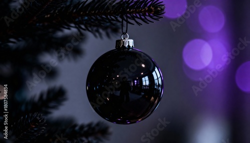 Festive Christmas background with hanging bauble on pine branch, magical blurred bokeh lights and empty copy space for text. Macro close-up of New Year decoration.