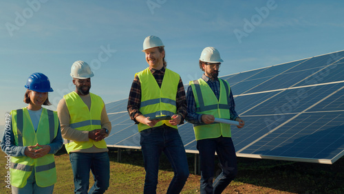 Photos Professionals discuss solar energy project during daytime at solar panel install