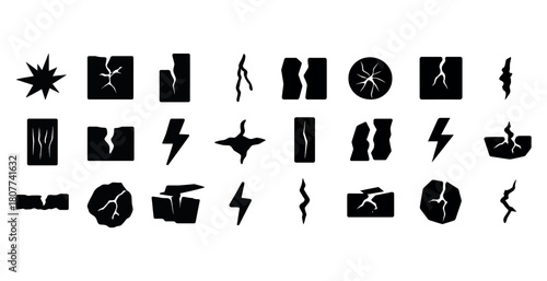 Collection of various crack and damage silhouettes with lightning symbols