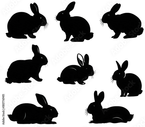 A collection of black rabbit silhouettes in various poses isolated on white.