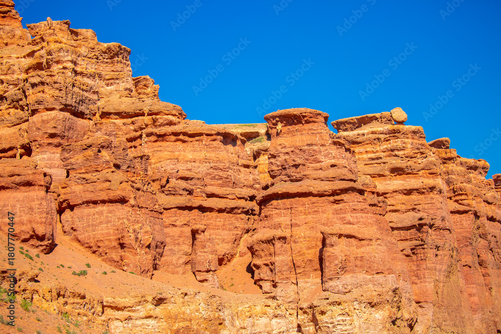 Fototapeta premium Charyn Canyon, Valley of Castles. The excellence of Kazakhstan. Panorama of natural unusual landscape. The red canyon of extraordinary beauty looks like a Martian landscape.