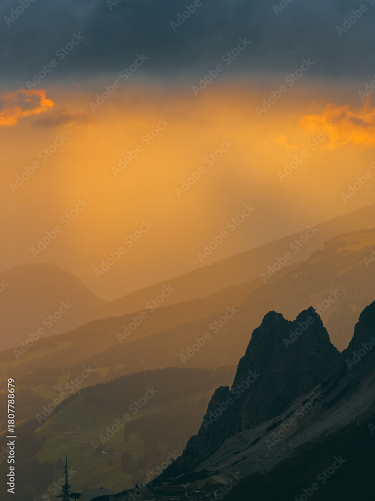 Obraz premium Sunset Over Mountain Peaks Alps