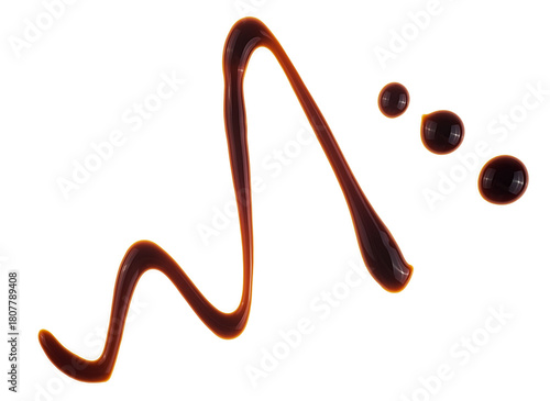 Smear of soy sauce isolated on a white background, top view. Spilled soy sauce.
