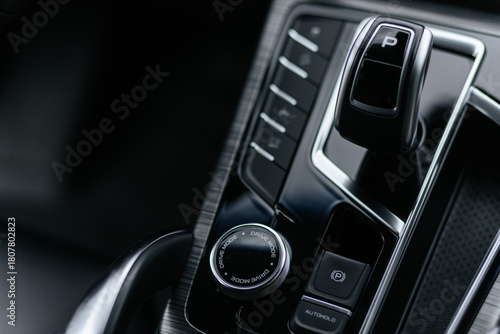 Close-Up Of Modern Car Center Console With Gear Shifter And Drive Mode Dial